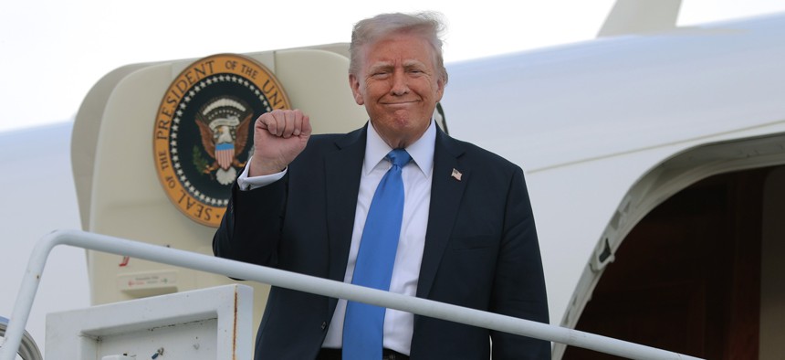 President Donald Trump disembarks from Air Force One at Tuscaloosa National Airport on May 01, 2025 in Tuscaloosa, Alabama. Trump released his "skinny" budget proposal May 2 with sweeping cuts to civilian agencies.